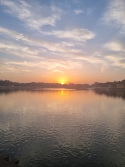 A serene sunrise over a calm lake symbolizing new beginnings and hope.