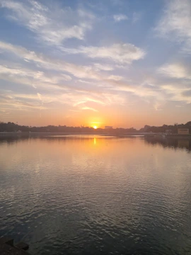 A serene sunrise over a calm lake symbolizing inner peace and new beginnings.