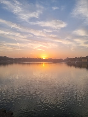 A serene sunrise over a calm ocean, symbolizing new beginnings and healing.