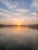 A serene sunrise over the Ganges, illuminating the ancient ghats of Varanasi.