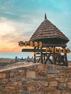 A group of smiling tourists exploring a historic Ukrainian castle with Victoria Voyage guides.