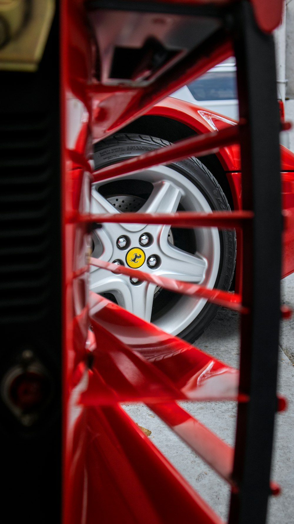 a close up of a tire on a red car