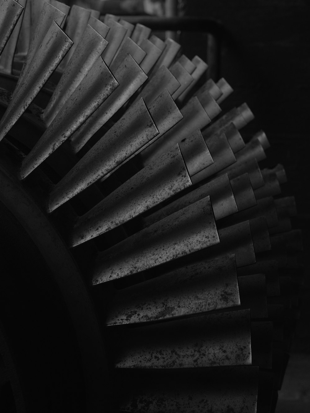 a black and white photo of a large metal object