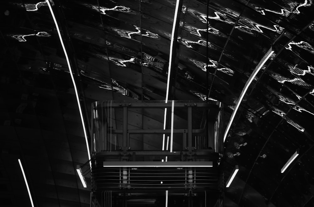 a black and white photo of lights in a building