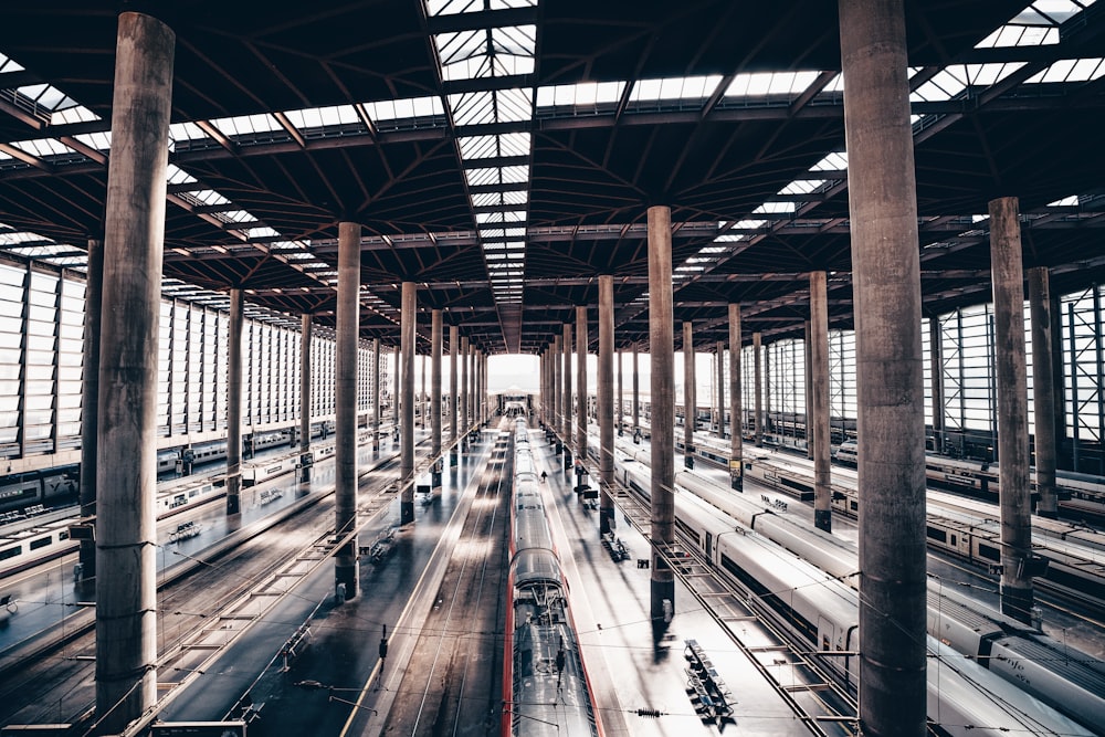 a train station filled with lots of train tracks