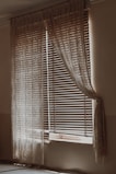 Cozy room with layered curtains and shades