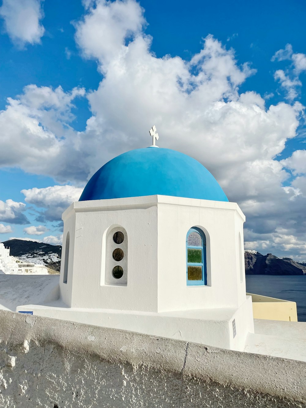 a white and blue building with a blue dome