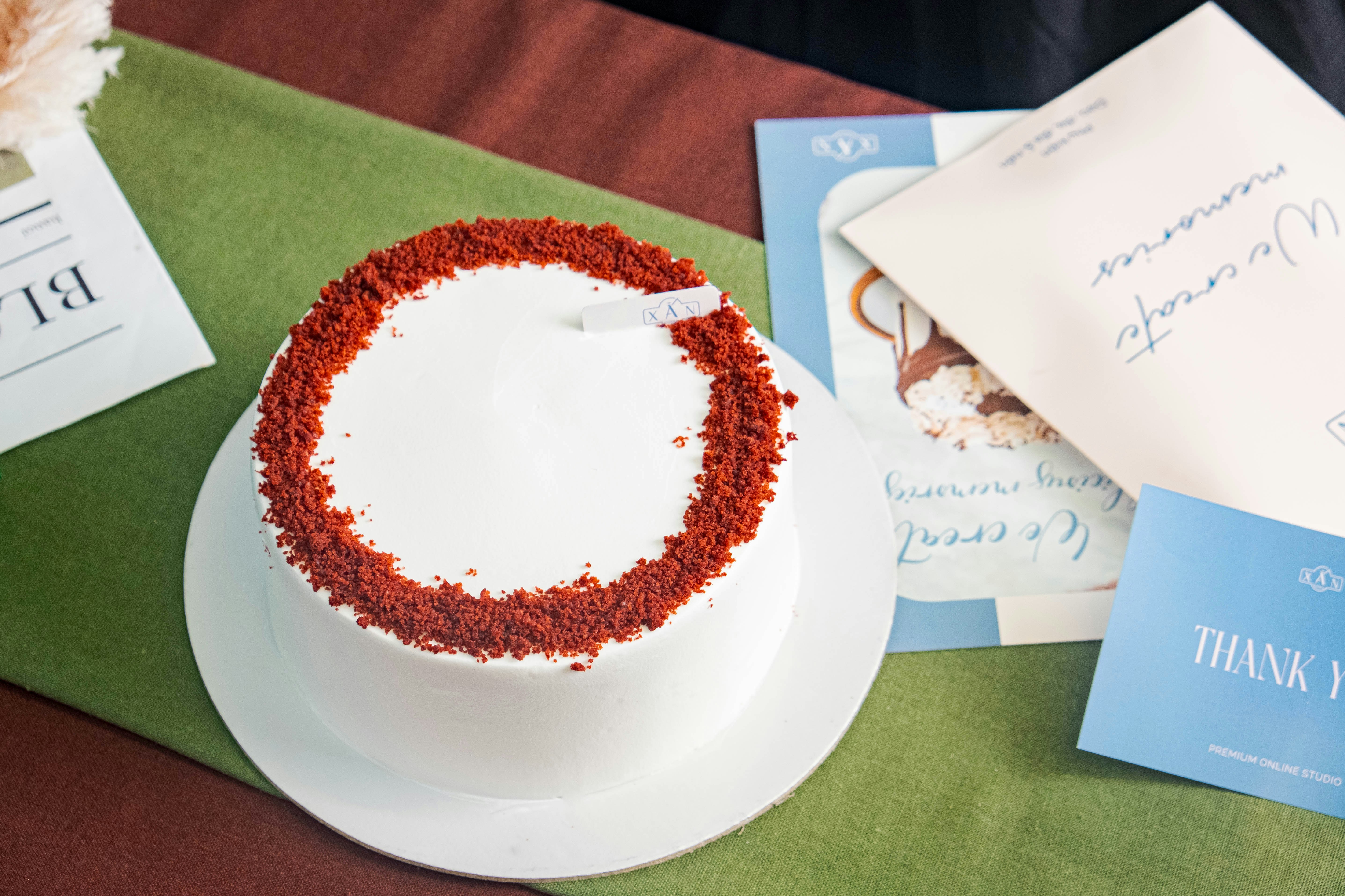a white cake sitting on top of a white plate