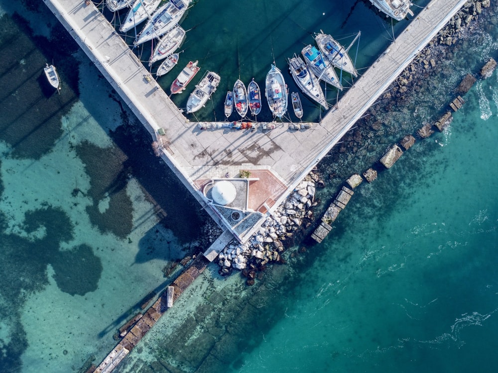 an aerial view of a marina with boats docked