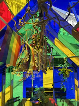 A colorful, welcoming workspace with pride flags and cozy decor.