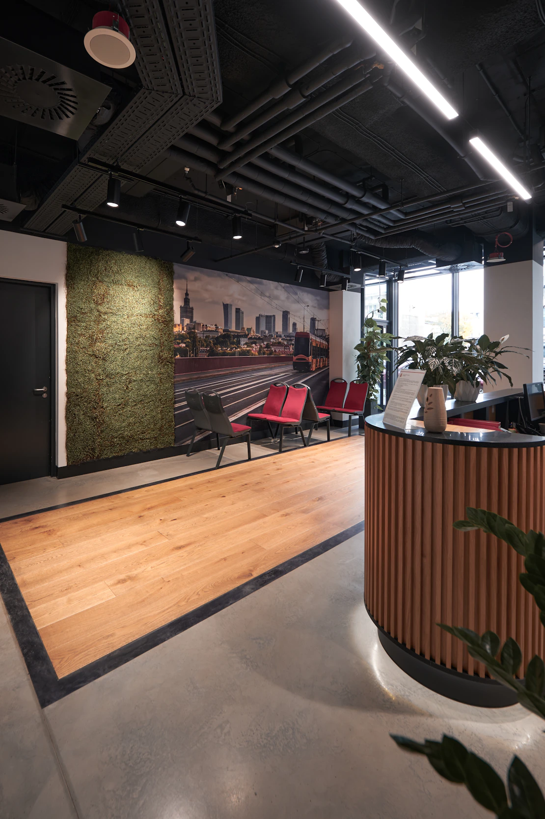 Modern office reception area with solar energy posters on the walls.