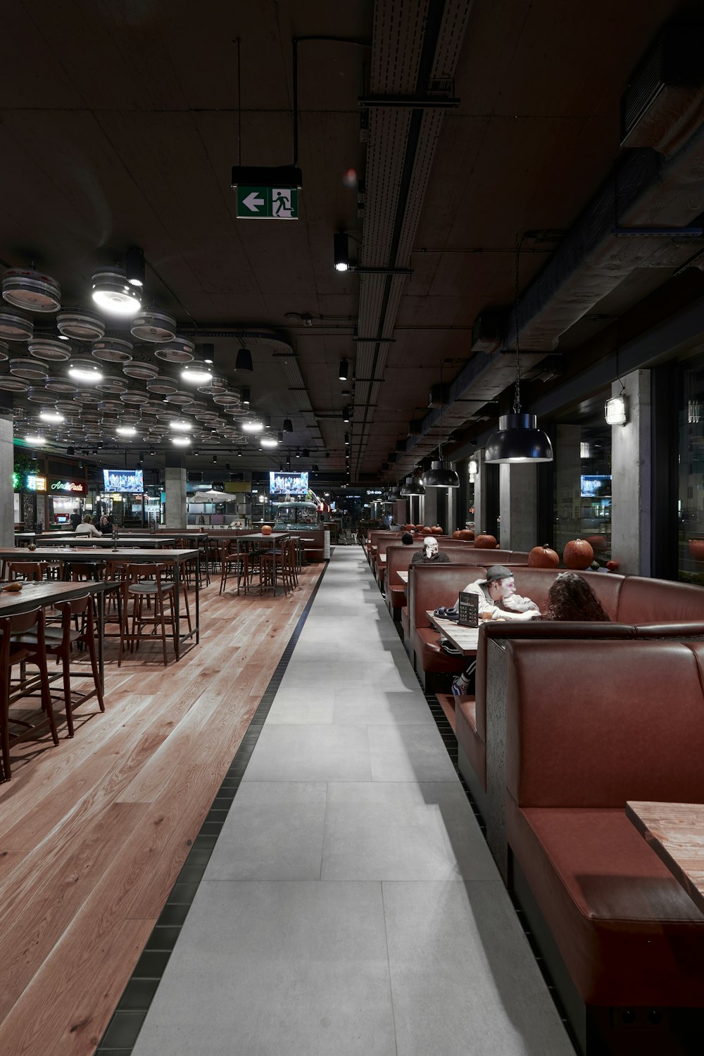 a restaurant filled with lots of tables and chairs