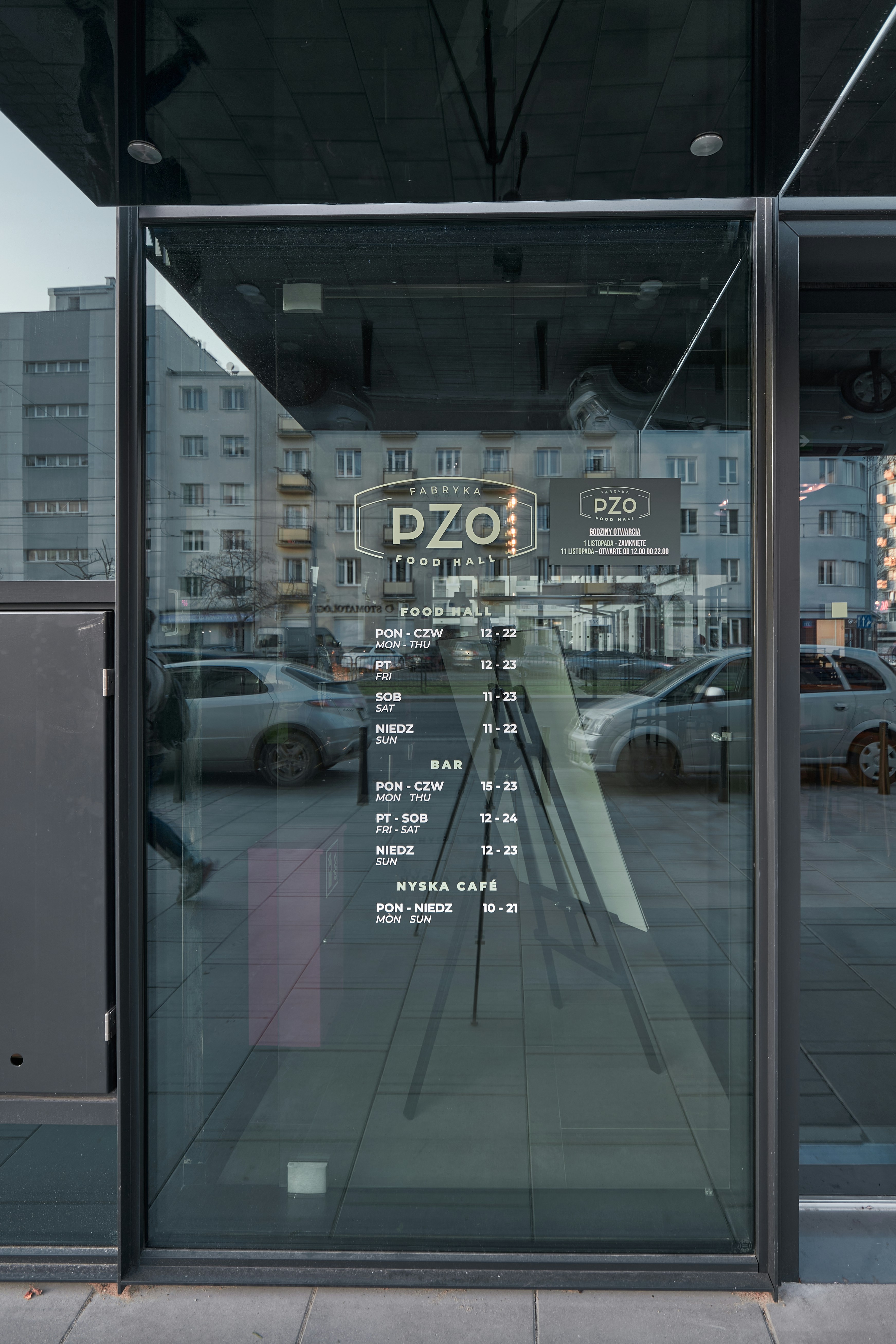 A large glass window with a sign on it photo – Free Office Image on ...