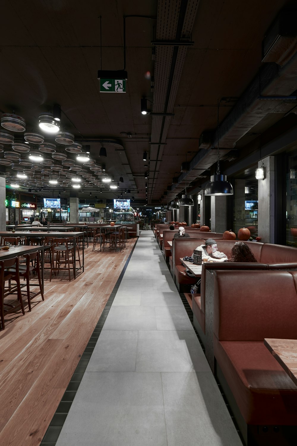 a restaurant filled with lots of tables and chairs