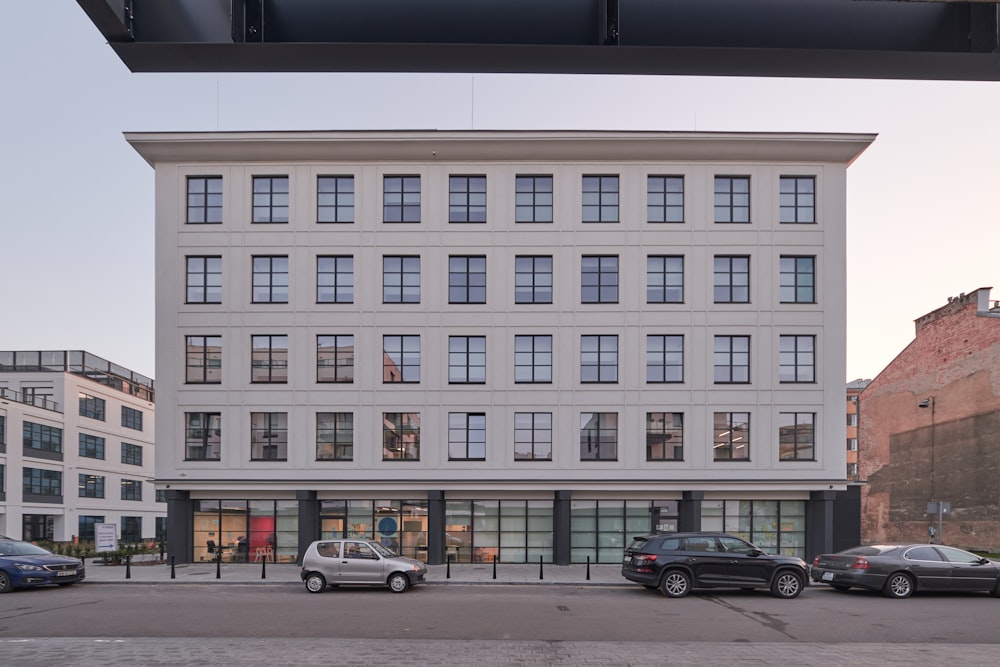 a building with several cars parked in front of it