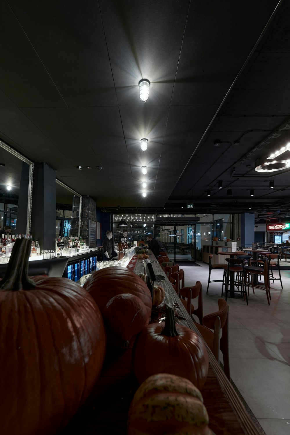 a long row of pumpkins in a restaurant