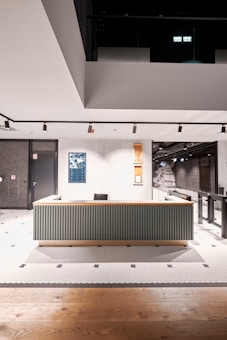 a room with a large desk in the middle of it