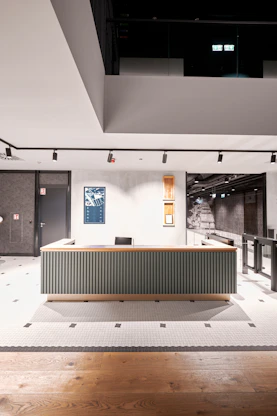 a room with a large desk in the middle of it