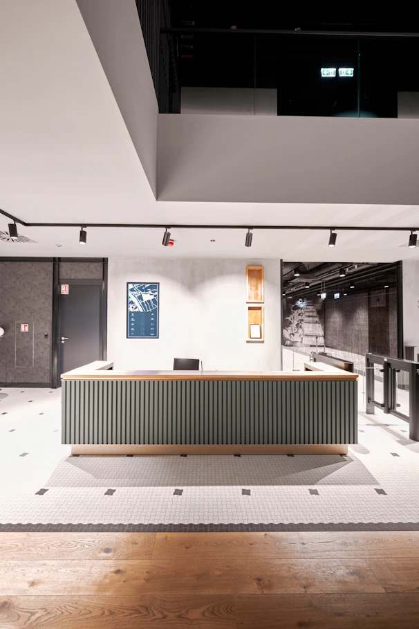 a room with a large desk in the middle of it