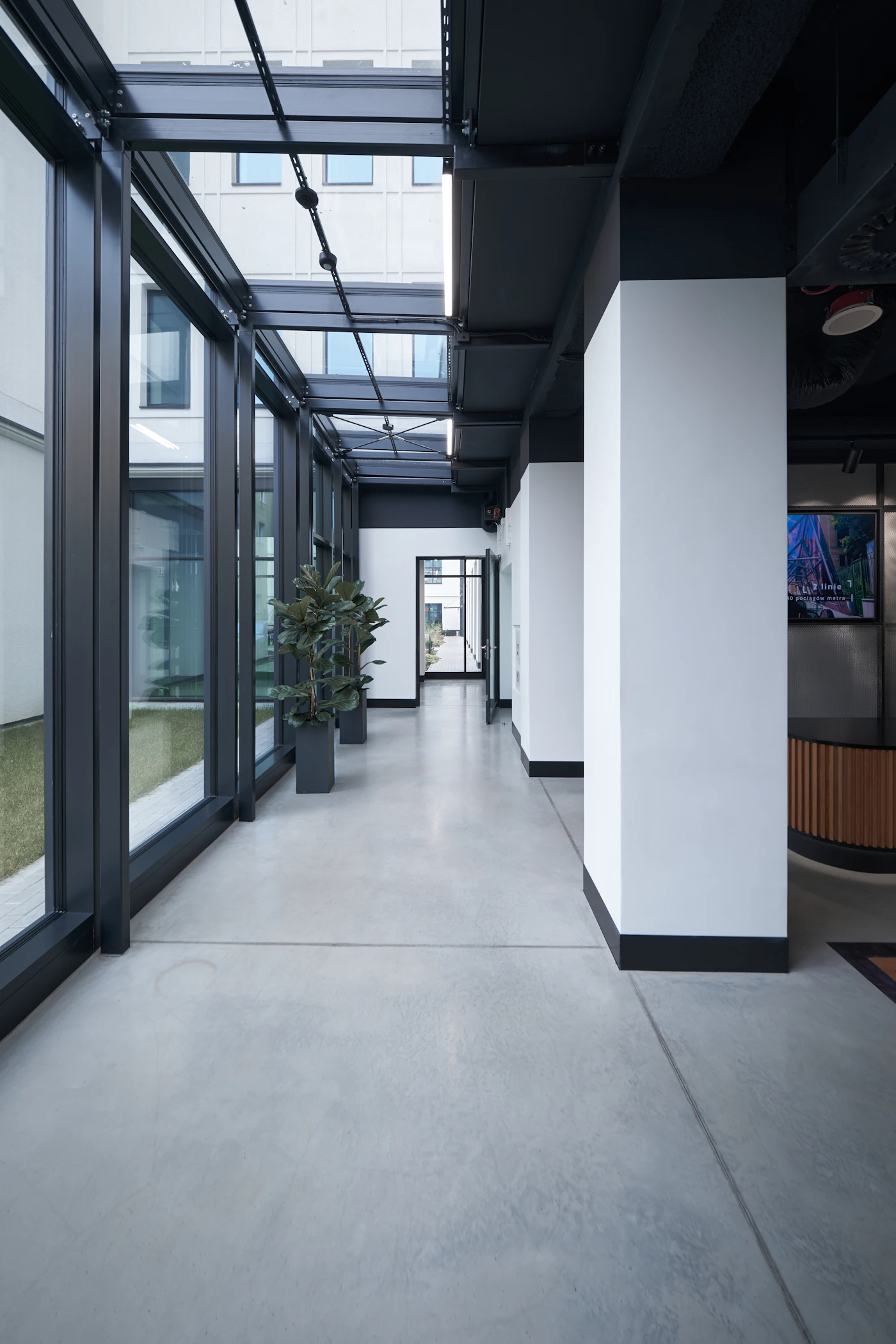 Long commercial office hallway representative of multi-site facility management
