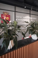 Stylish reception area featuring the projekt m logo on the wall