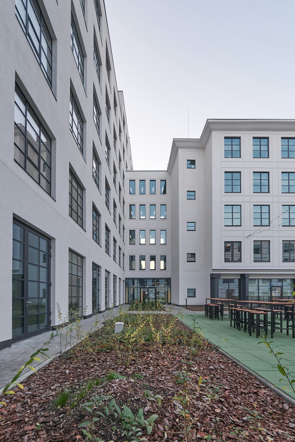 a group of buildings with a green roof