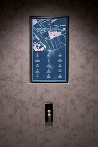 People interacting with a large touchscreen map display.