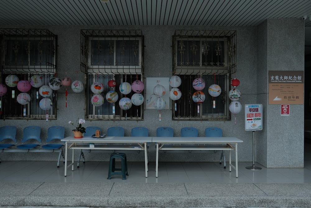 a table and chairs in front of a building