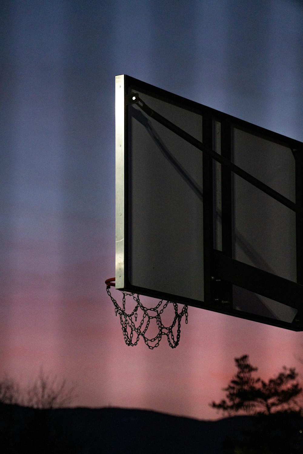 a basketball hoop with a chain hanging from it