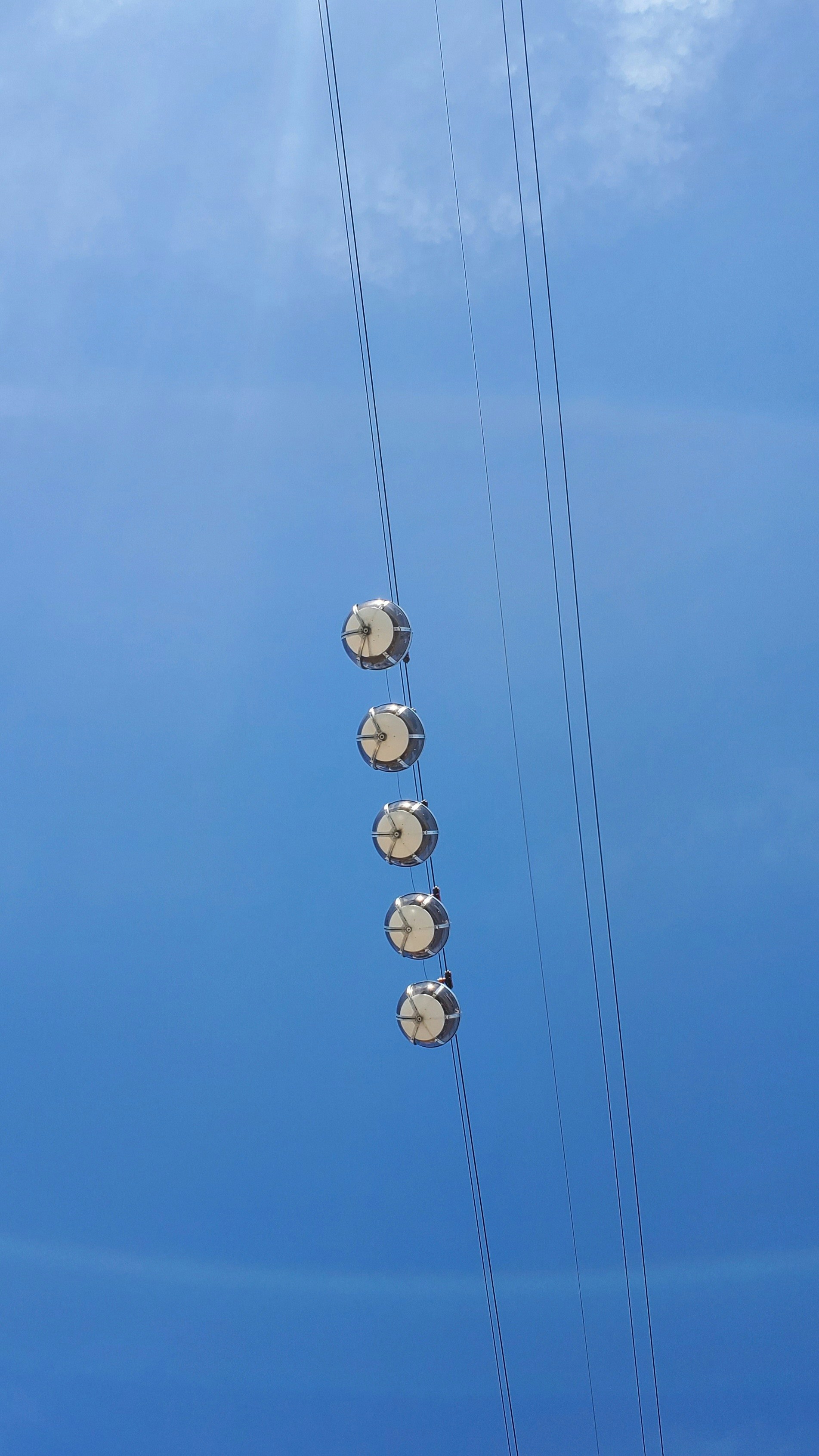 a telephone pole with a bunch of wires attached to it