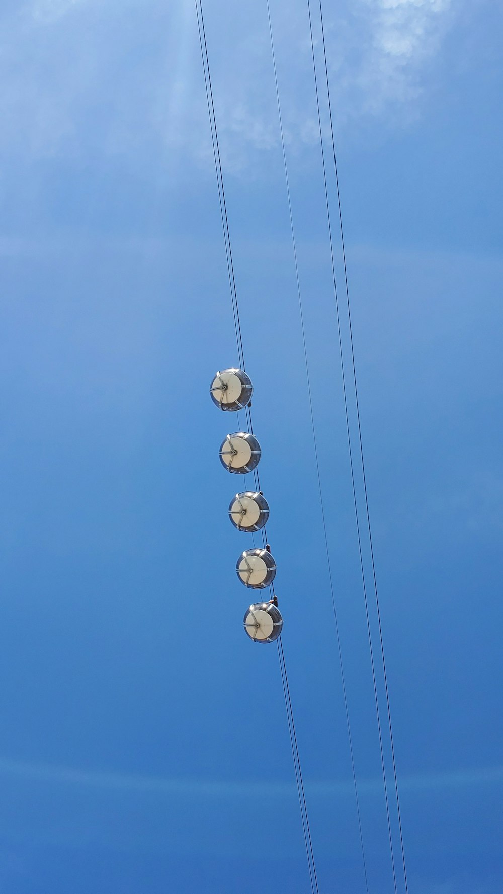 a telephone pole with a bunch of wires attached to it