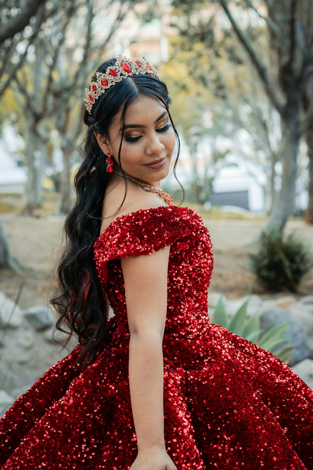 A woman wearing a red dress and a tiara photo – Free Dress Image on Unsplash