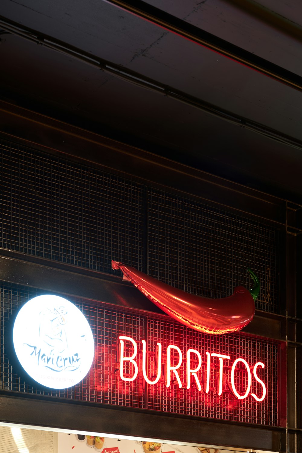 a neon sign that says burritos on it