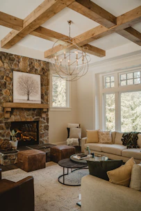 Cozy living room featuring a fireplace, plush sofa, and tasteful decor in warm tones.