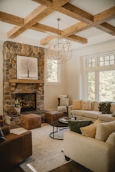 A cozy living room featuring a beautifully built fireplace as the focal point.