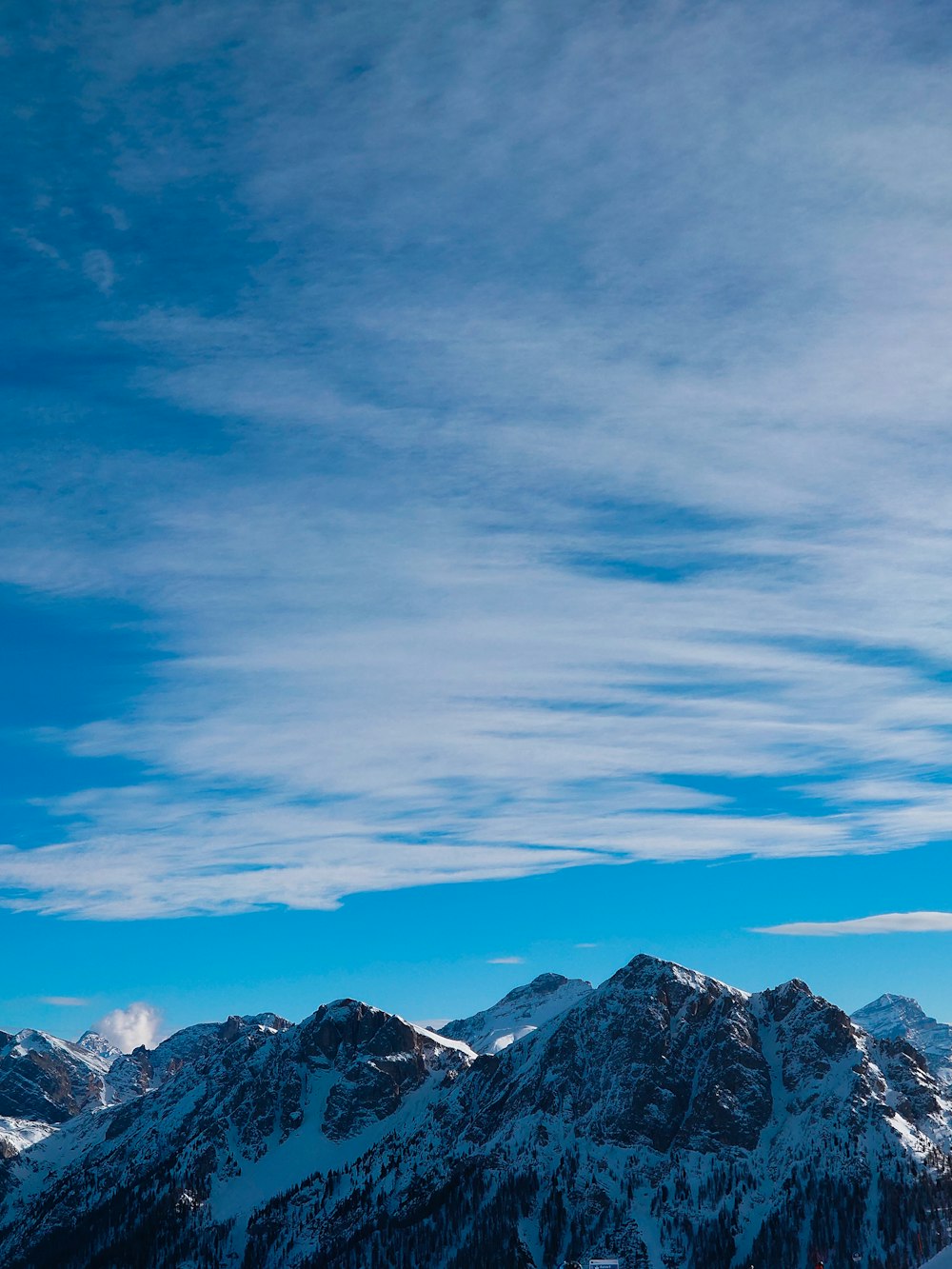 a man riding skis on top of a snow covered slope