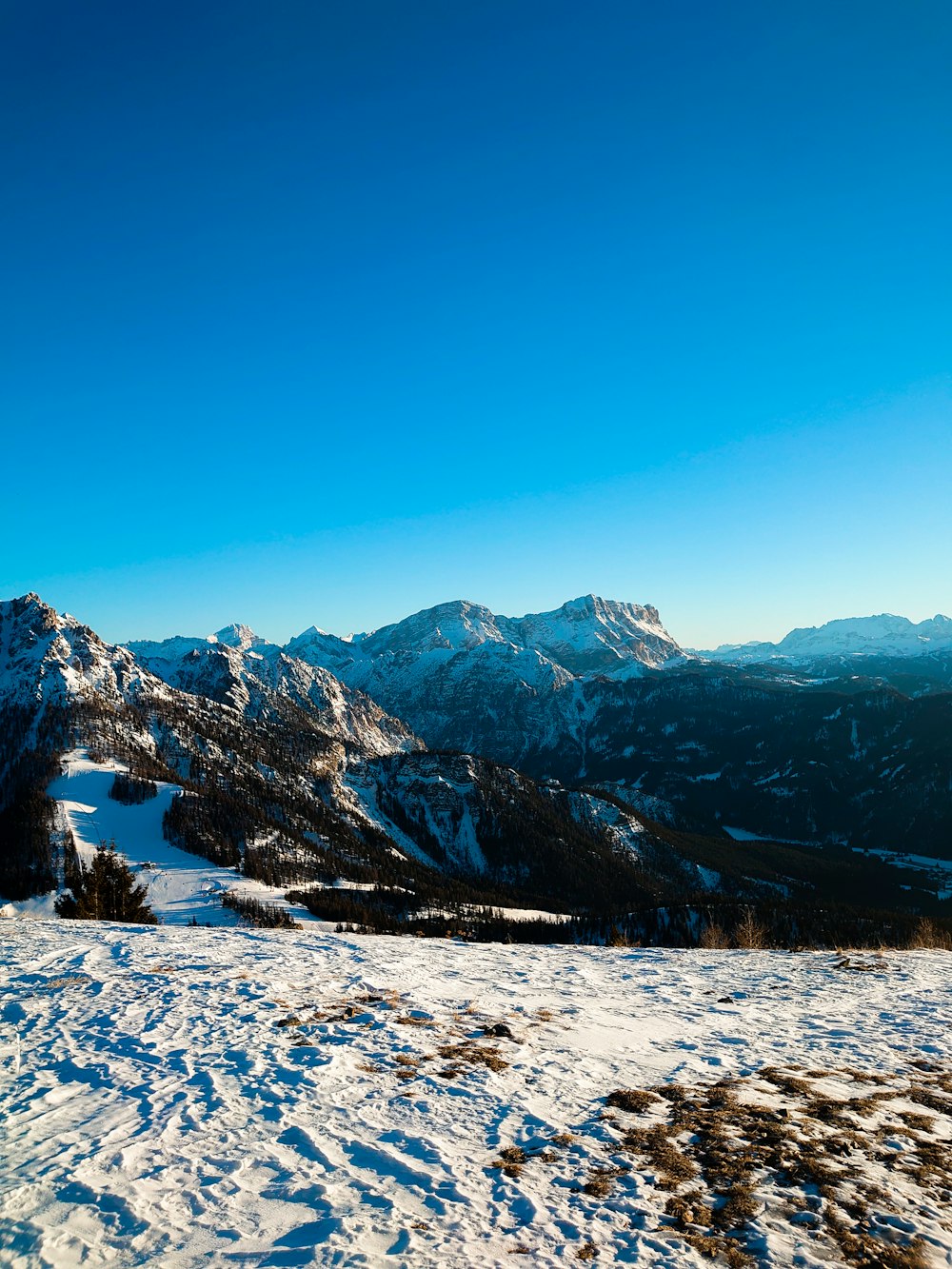 a person standing on top of a snow covered slope