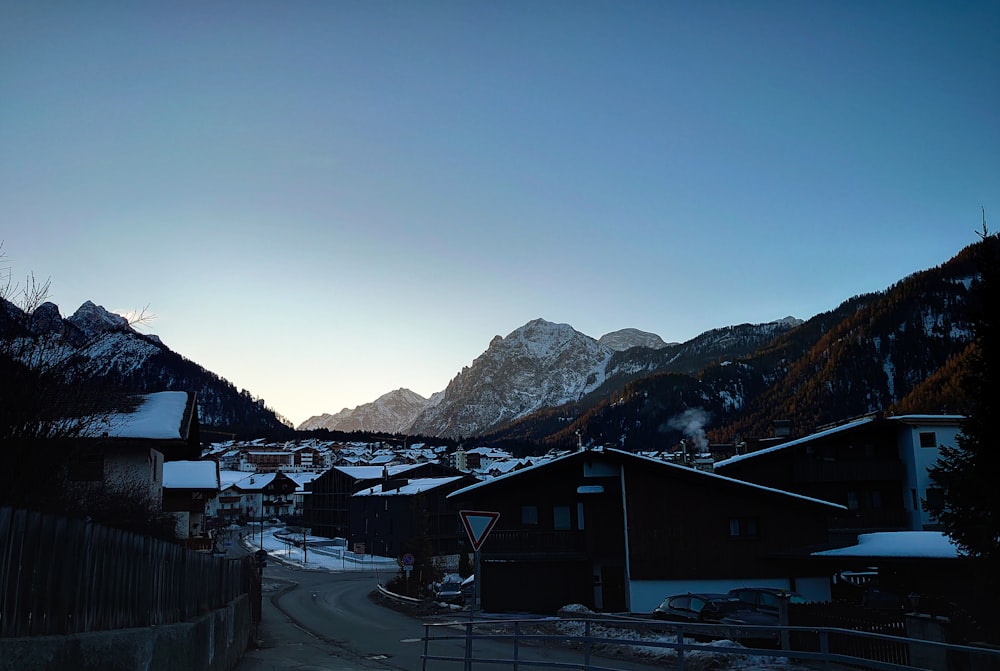 a small town with mountains in the background