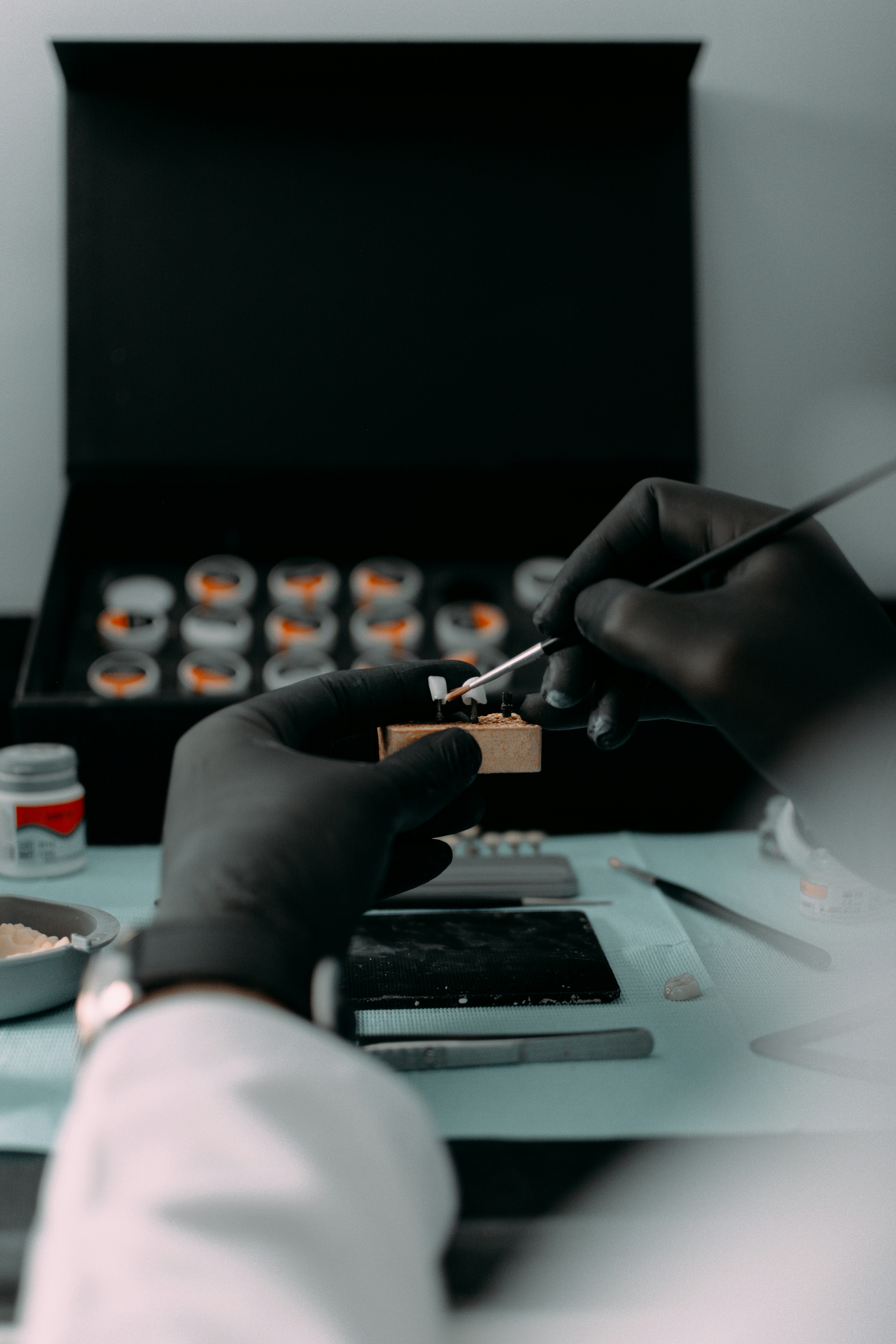 a person in a lab coat is doing something