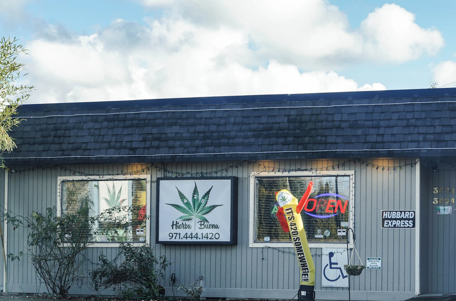 Independent cannabis dispensary storefront representing a multi-location retail operation in the USA