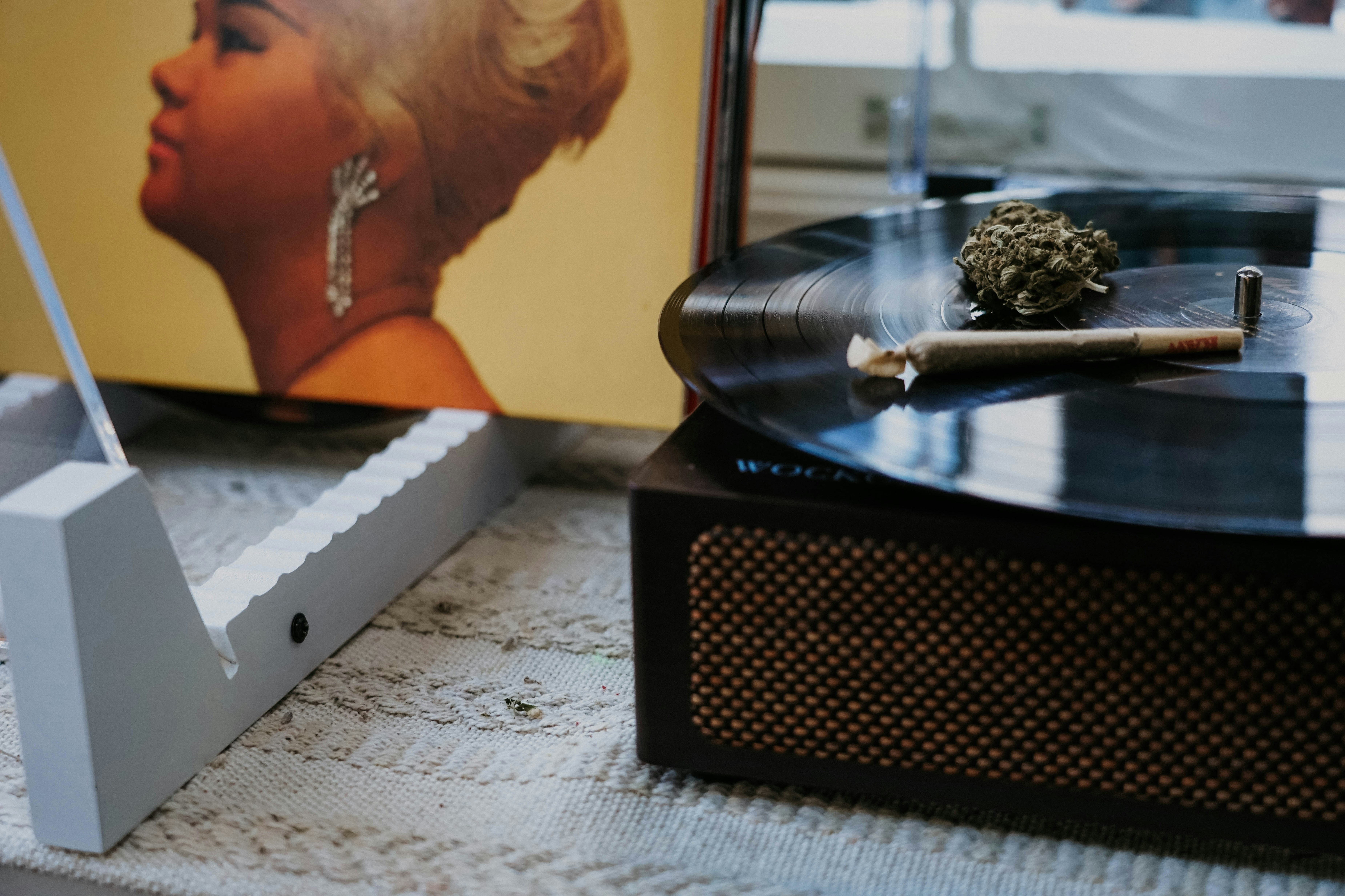 a record player sitting next to a record player