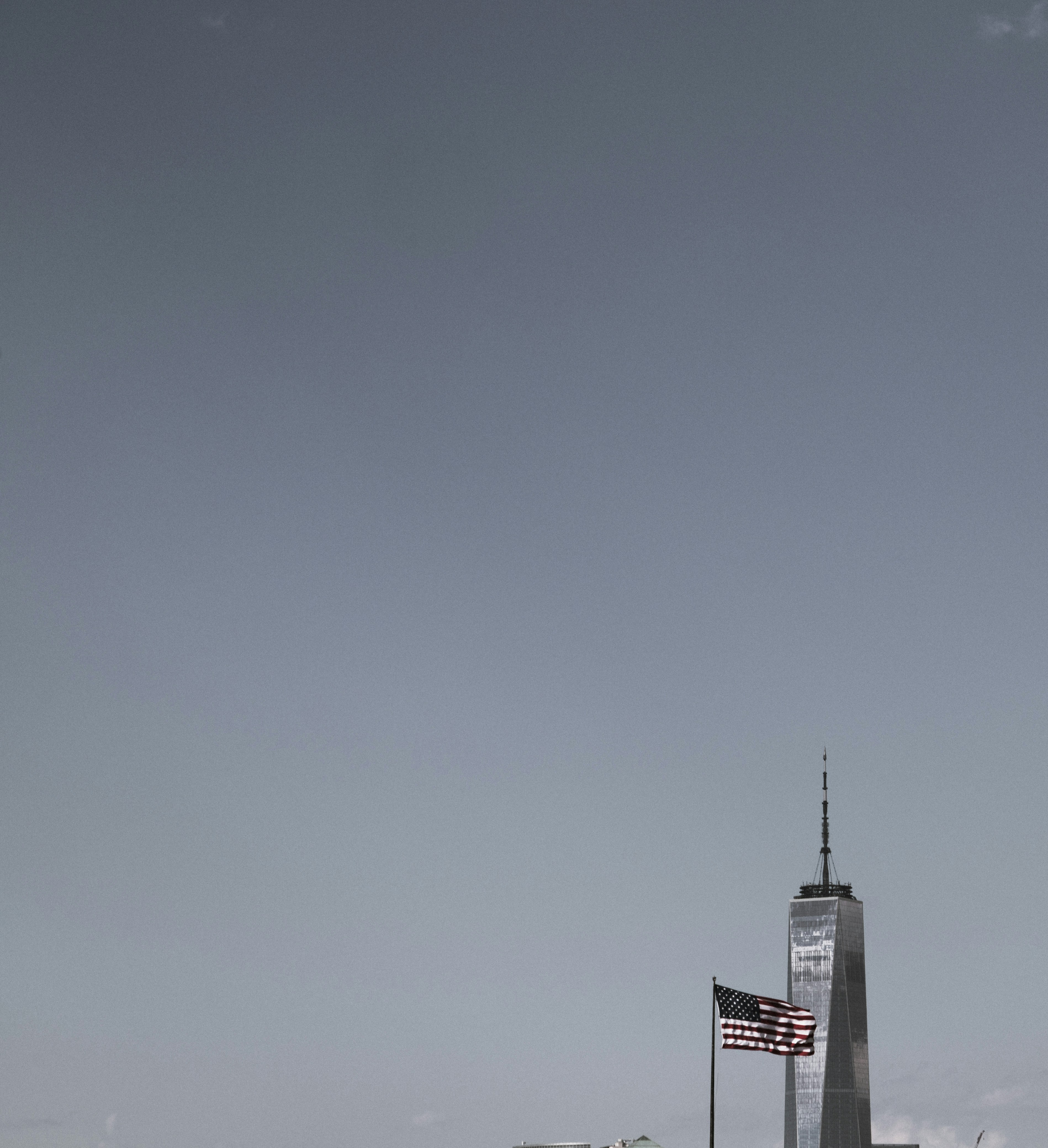 a tall building with a flag on top of it