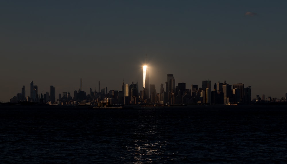 a view of a city at night from the water