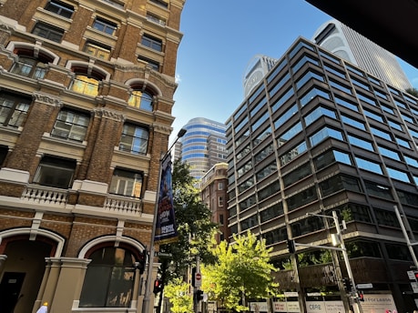 a couple of tall buildings sitting next to each other