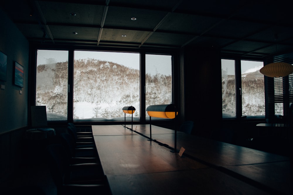 a conference room with a view of a snowy mountain