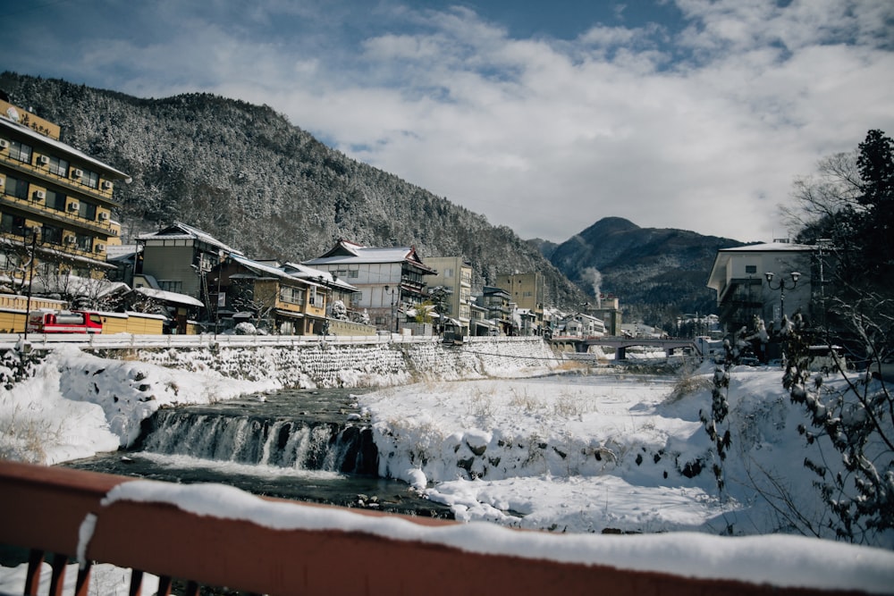 a river running through a snow covered town