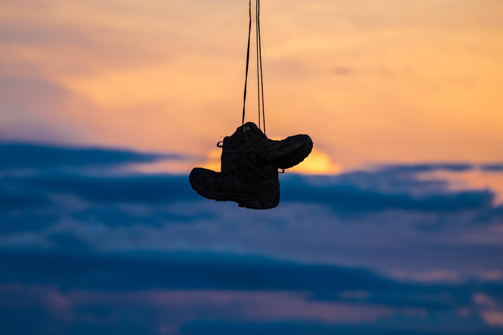 a pair of shoes hanging from a string