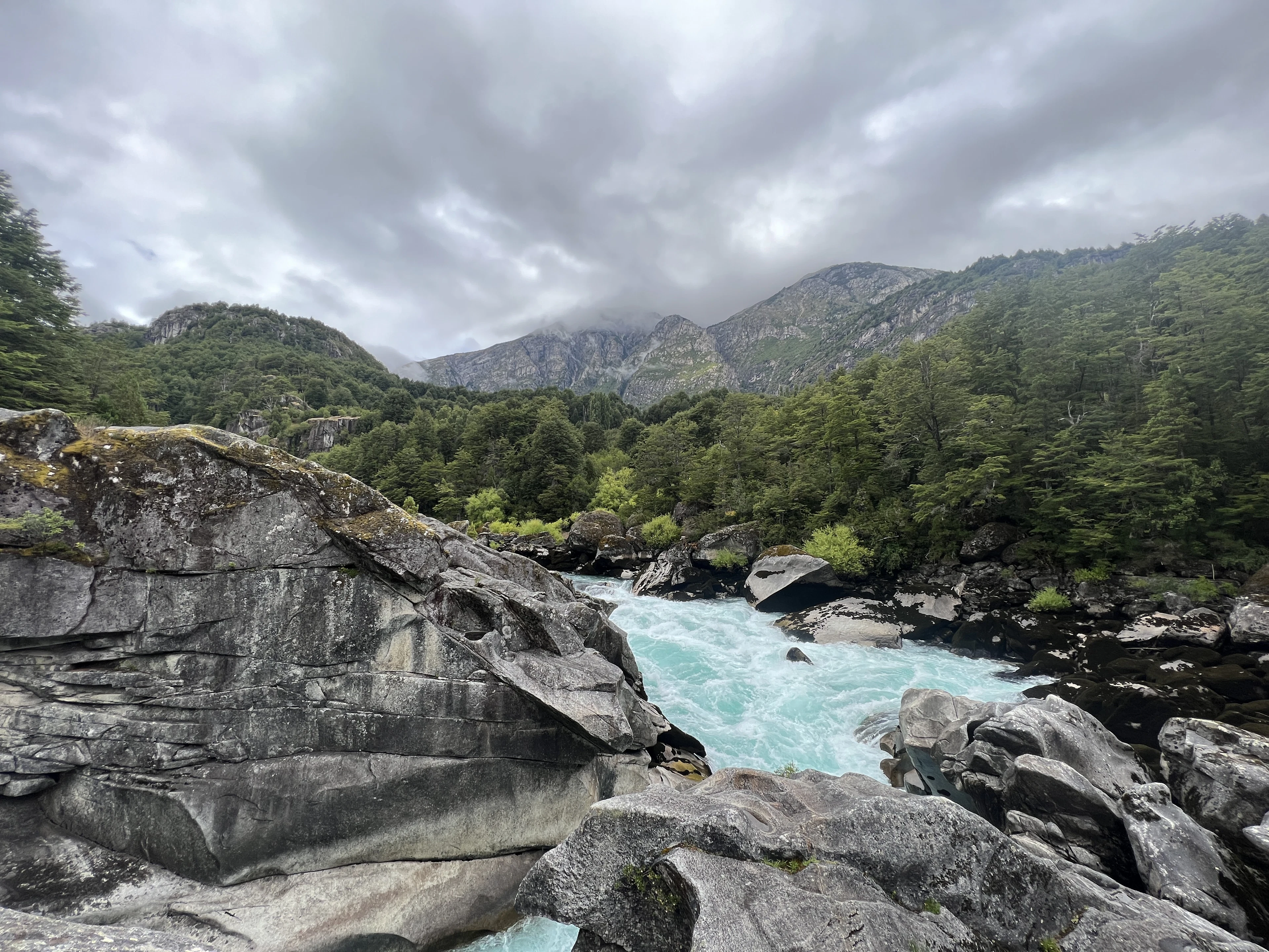 The turquoise Futaleufú river between granite boulders and forested mountains, Chile