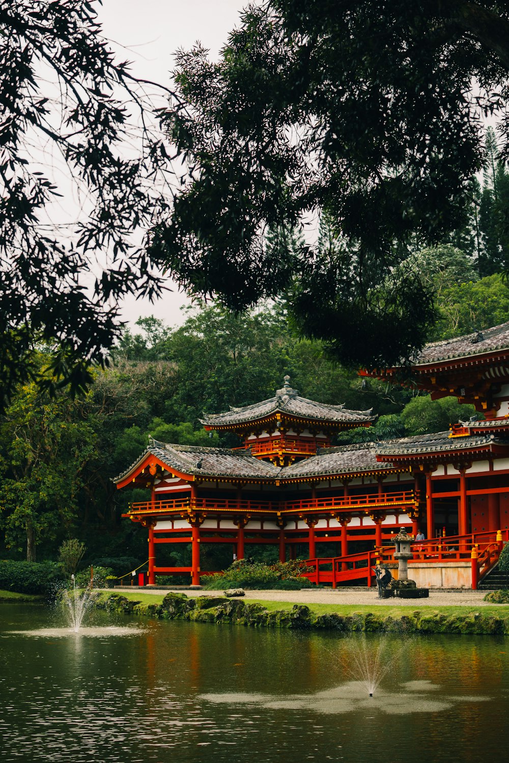 a large building sitting next to a body of water