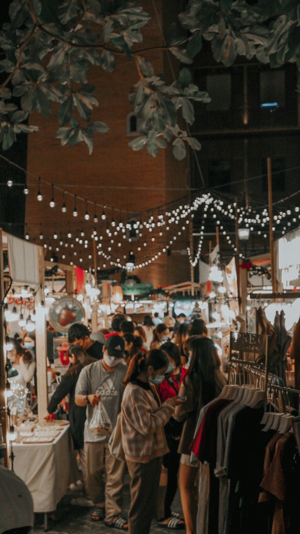 a group of people standing around a market